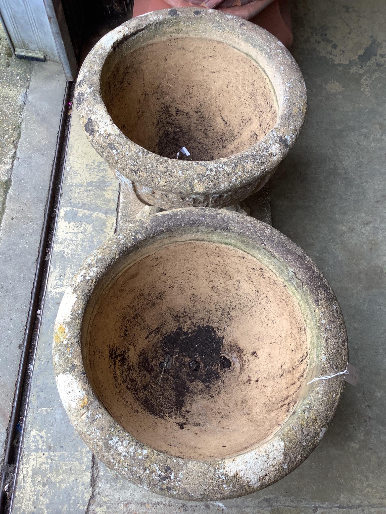 A pair of 19th century circular reconstituted stone garden planters on square plinth bases, diameter 60cm, height 54cm